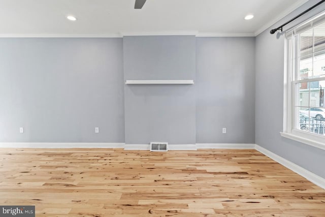 unfurnished room featuring recessed lighting, visible vents, baseboards, ornamental molding, and wood finished floors