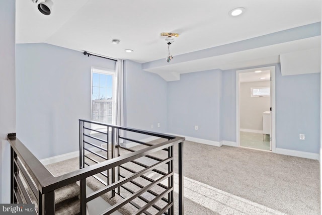 empty room with carpet, recessed lighting, and baseboards