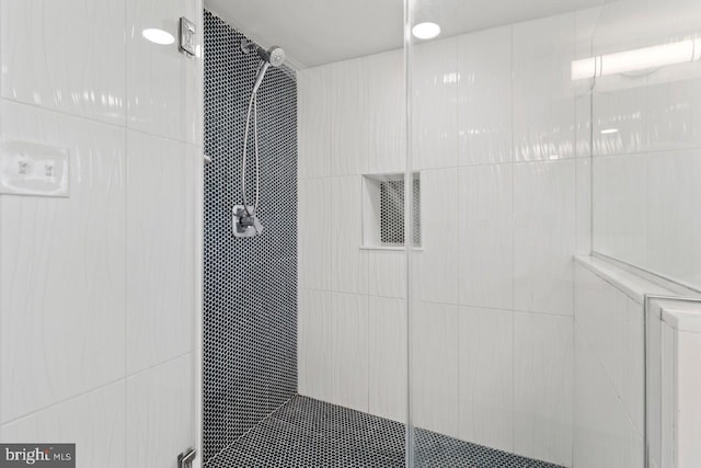 full bathroom featuring a shower stall