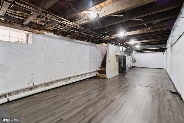 below grade area with dark wood finished floors and stairs