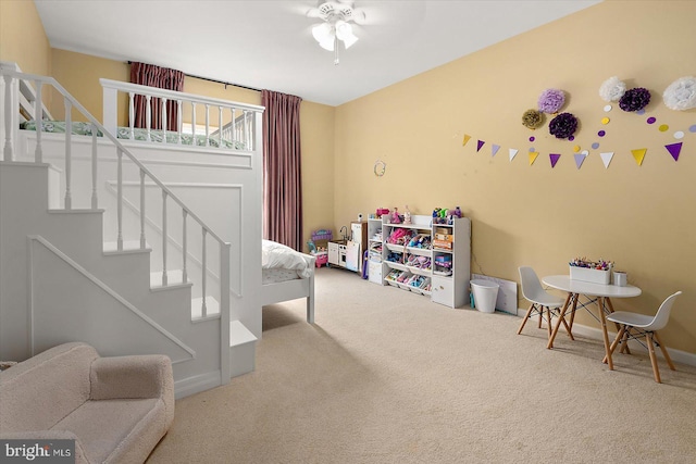 game room featuring a ceiling fan, baseboards, and carpet floors