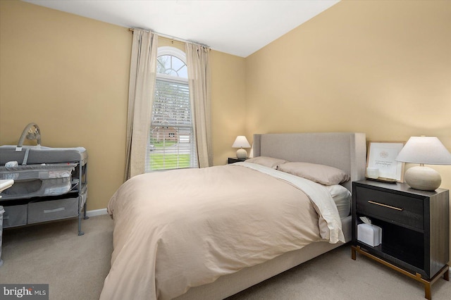 bedroom featuring baseboards and carpet flooring