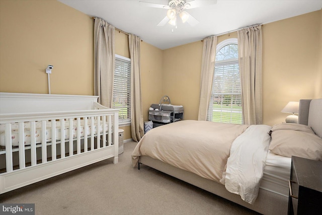 bedroom with carpet and a ceiling fan
