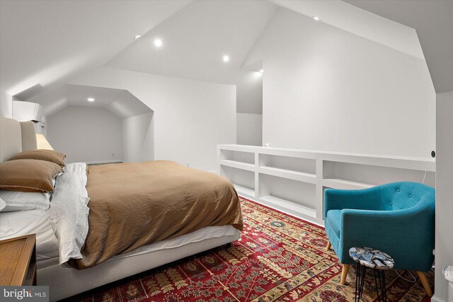 bedroom featuring lofted ceiling, a wall mounted AC, and recessed lighting