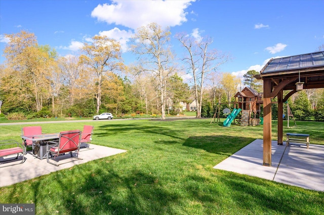 view of yard featuring a patio area and a playground