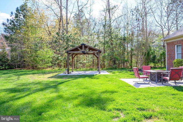view of yard with a patio area, a fire pit, and a gazebo