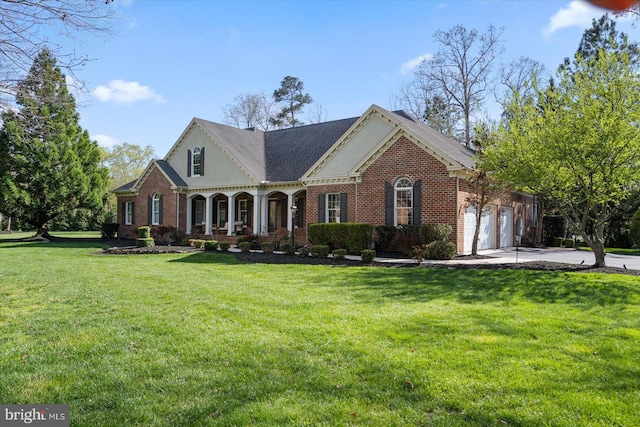 view of front of home featuring brick siding, an attached garage, driveway, and a front lawn