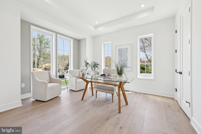 home office with baseboards, recessed lighting, light wood-style floors, and a raised ceiling