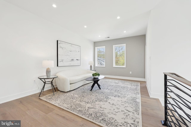 sitting room featuring recessed lighting, light wood-type flooring, and baseboards