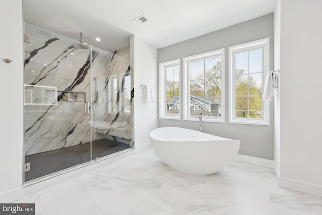 full bath featuring a marble finish shower, a freestanding bath, baseboards, visible vents, and marble finish floor