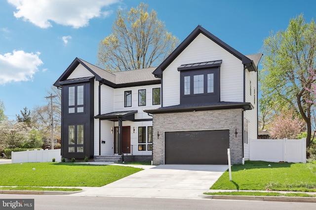 view of front of home with an attached garage, a front lawn, fence, and driveway