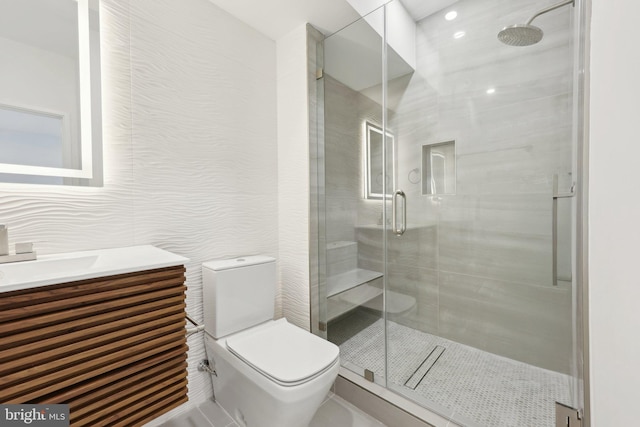 full bath with a shower stall, toilet, and vanity