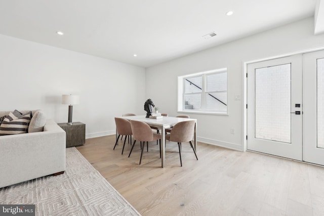 dining space with light wood finished floors, baseboards, recessed lighting, and visible vents