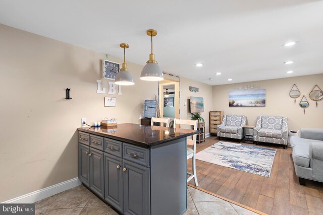 111 W 18th St Unit 2, Ship Bottom, NJ 08008 - kitchen featuring a peninsula, baseboards, a kitchen bar, recessed lighting, and open floor plan