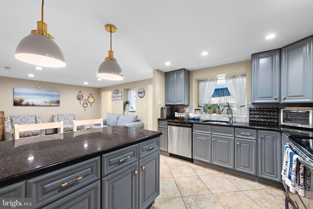 111 W 18th St Unit 2, Ship Bottom, NJ 08008 - kitchen featuring a sink, tasteful backsplash, appliances with stainless steel finishes, light tile patterned floors, and a toaster