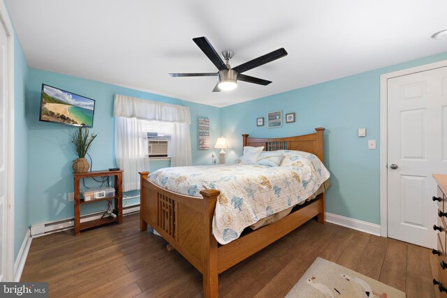 111 W 18th St Unit 2, Ship Bottom, NJ 08008 - bedroom with baseboards, wood finished floors, a ceiling fan, and a baseboard radiator