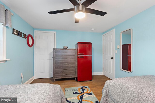 111 W 18th St Unit 2, Ship Bottom, NJ 08008 - bedroom featuring baseboards, wood finished floors, and ceiling fan