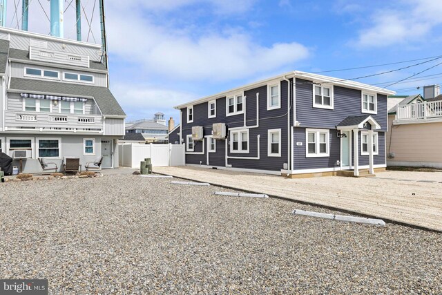 111 W 18th St Unit 2, Ship Bottom, NJ 08008 - rear view of house with cooling unit and fence