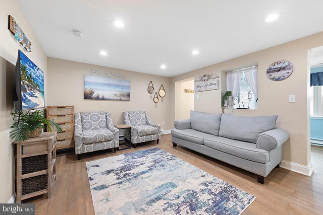 111 W 18th St Unit 2, Ship Bottom, NJ 08008 - living area featuring recessed lighting, baseboard heating, baseboards, and wood finished floors