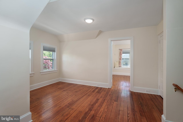 interior space with baseboards and hardwood / wood-style floors