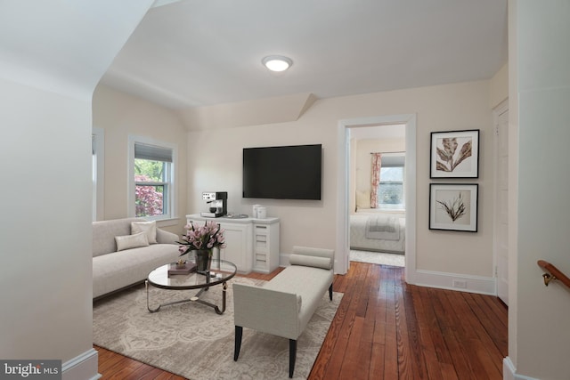 living room with baseboards and hardwood / wood-style floors