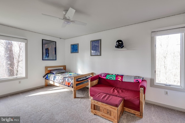 bedroom with a ceiling fan, carpet, and baseboards