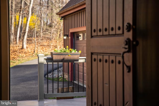 view of exterior entry featuring board and batten siding