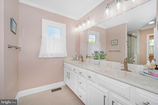 full bath featuring visible vents, a sink, baseboards, and a wealth of natural light