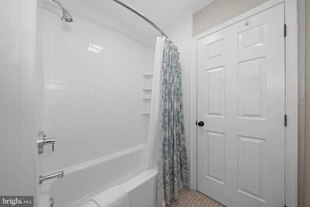 bathroom with shower / bath combination with curtain and tile patterned flooring