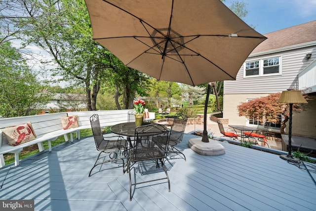 deck featuring outdoor dining space
