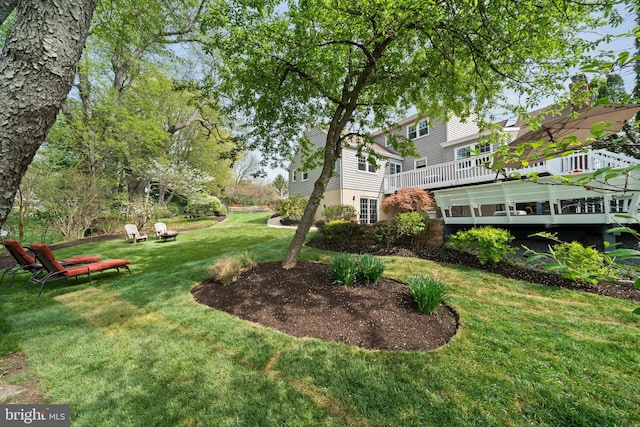 view of yard featuring a wooden deck