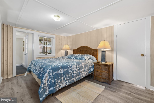 bedroom with wood finished floors