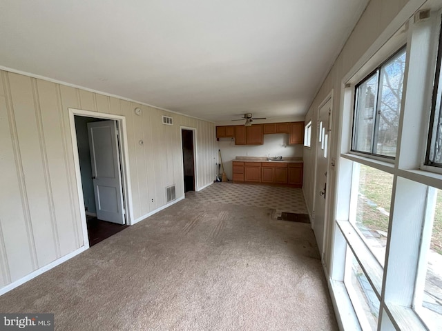 8183 Forest Glen Dr, Pasadena, MD 21122 - unfurnished living room featuring ceiling fan, visible vents, and light colored carpet