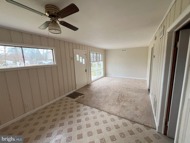 8183 Forest Glen Dr, Pasadena, MD 21122 - foyer with baseboards, visible vents, a ceiling fan, and light carpet