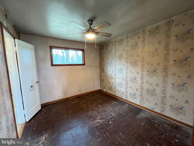 8183 Forest Glen Dr, Pasadena, MD 21122 - unfurnished bedroom with dark floors, wallpapered walls, baseboards, and ceiling fan