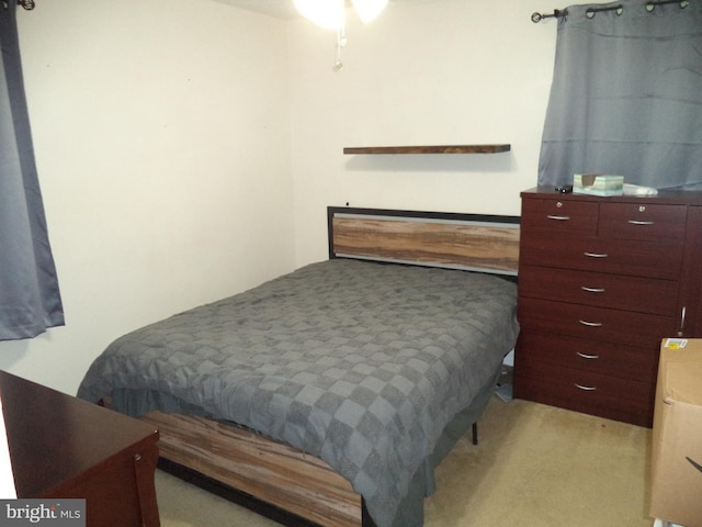 bedroom featuring light carpet