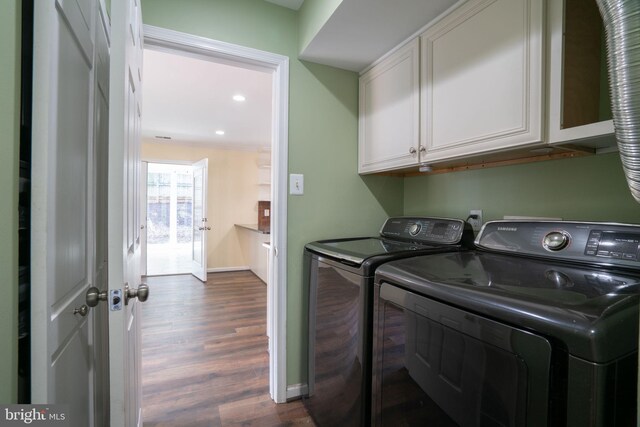 4501 Peppermill Ct, Dumfries, VA 22025 - laundry room with cabinet space, washing machine and clothes dryer, dark wood-style flooring, recessed lighting, and baseboards