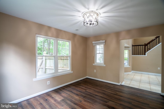 4501 Peppermill Ct, Dumfries, VA 22025 - unfurnished room featuring a chandelier, baseboards, and dark wood finished floors