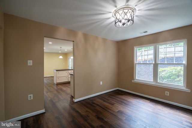 4501 Peppermill Ct, Dumfries, VA 22025 - empty room with dark wood-type flooring, baseboards, recessed lighting, and a chandelier