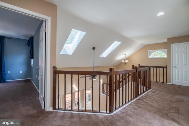 4501 Peppermill Ct, Dumfries, VA 22025 - corridor featuring a skylight, carpet, lofted ceiling, an upstairs landing, and baseboards