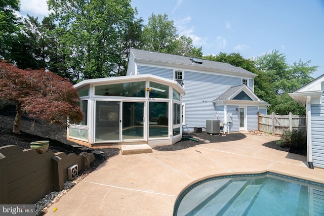 4501 Peppermill Ct, Dumfries, VA 22025 - rear view of property with a sunroom, a patio area, and central AC