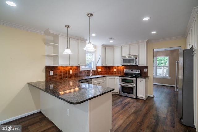 4501 Peppermill Ct, Dumfries, VA 22025 - kitchen featuring stainless steel appliances, a peninsula, white cabinetry, open shelves, and crown molding