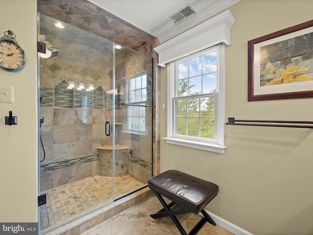 bathroom featuring a shower stall, visible vents, and baseboards