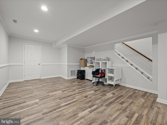 office area featuring wood finished floors, visible vents, and baseboards