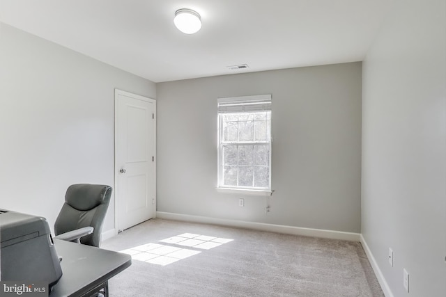 office with carpet floors and baseboards