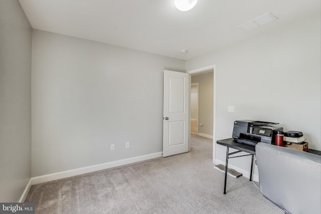 office area featuring baseboards and carpet