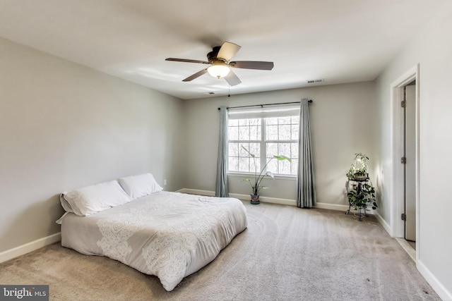bedroom with baseboards, carpet floors, and ceiling fan