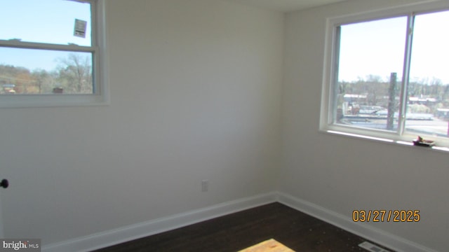 1261 Gallatin St NE, Washington, DC 20017 - unfurnished room with baseboards and dark wood-style floors