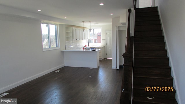 1261 Gallatin St NE, Washington, DC 20017 - staircase with baseboards, wood finished floors, recessed lighting, and a healthy amount of sunlight