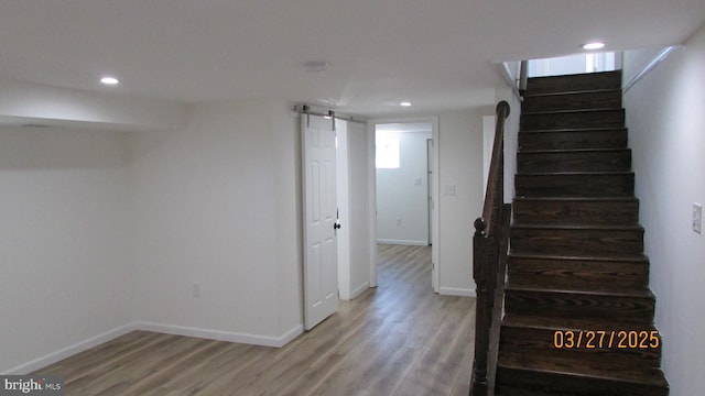 1261 Gallatin St NE, Washington, DC 20017 - stairway featuring baseboards, a barn door, wood finished floors, and recessed lighting